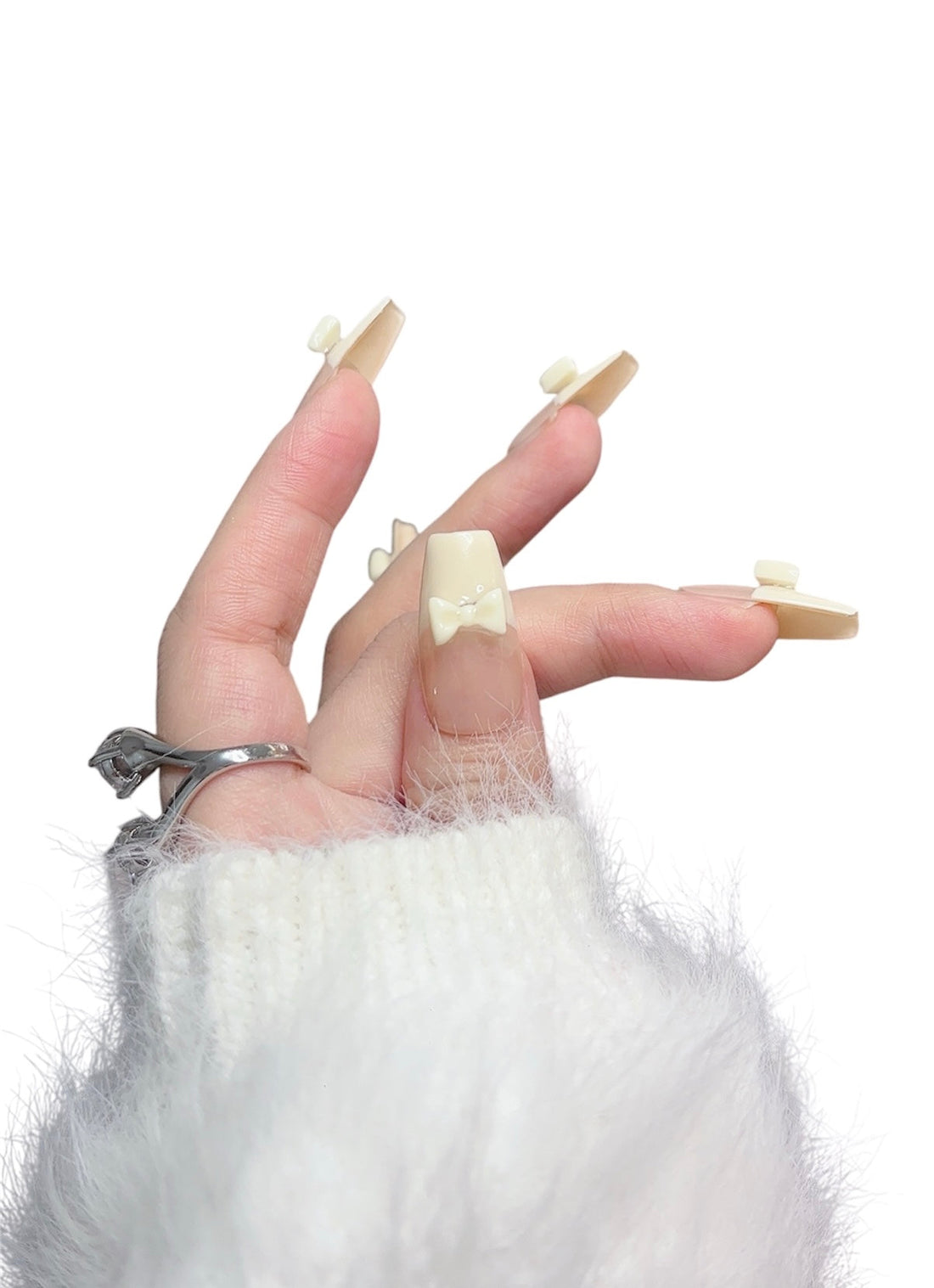Hand wearing handmade nude press-on nails designed for long-lasting everyday wear