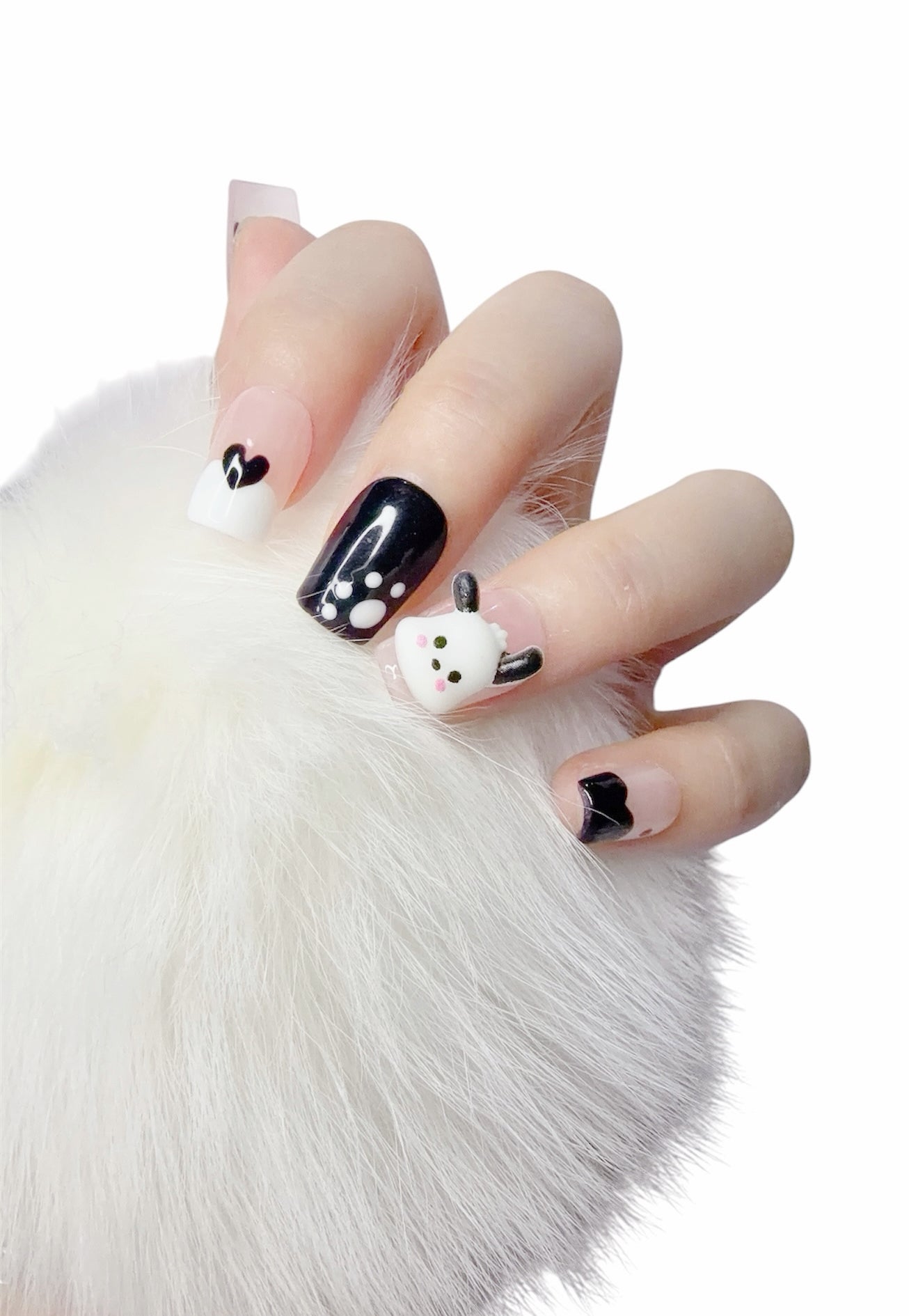 Hand wearing handmade black and white square press-on nails by Tipora