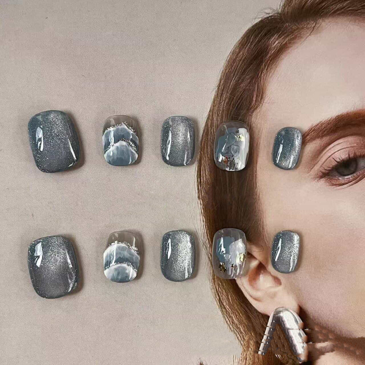 Short round blue cat eye handmade press-on nails with glossy finish by Tipora