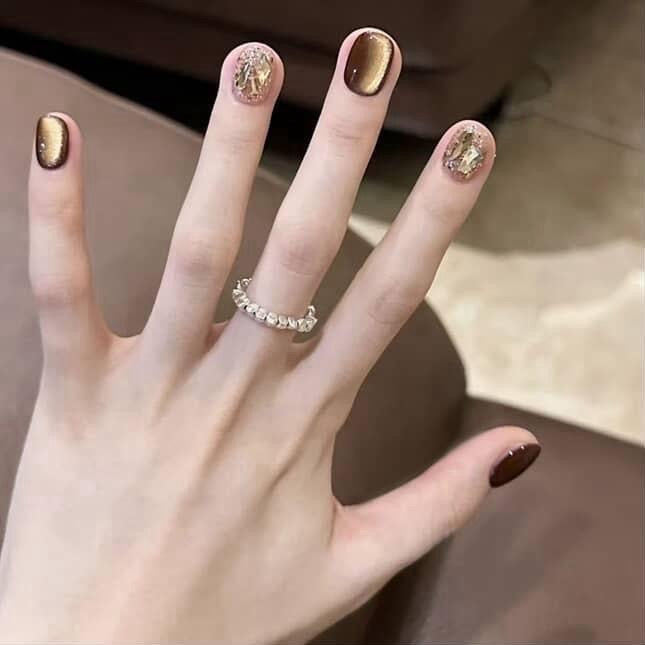 Cat eye nails with rhinestones
