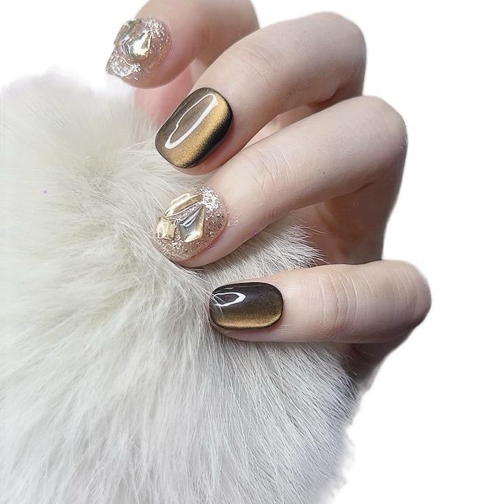 Short round brown cat eye handmade press-on nails with beige accents and rhinestones by Tipora