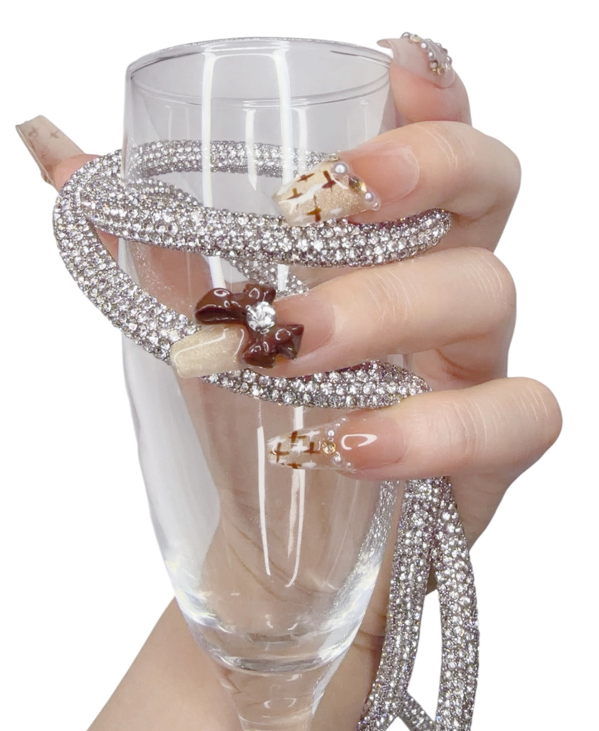 Long coffin press-on nails featuring delicate bow nail art